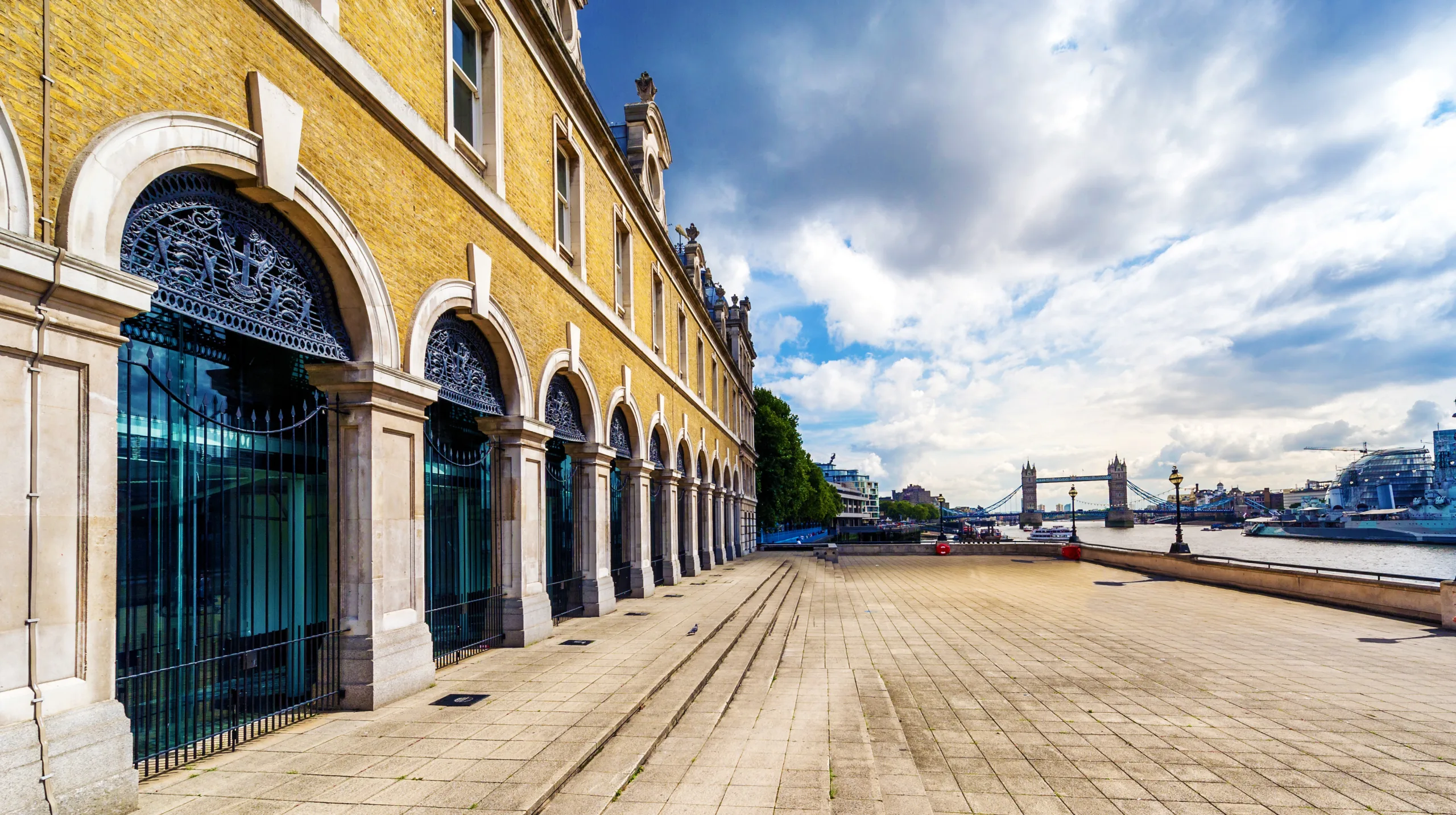 Exterior longshot of riverside walkway outside of Old Billingsgate on a cloudy day