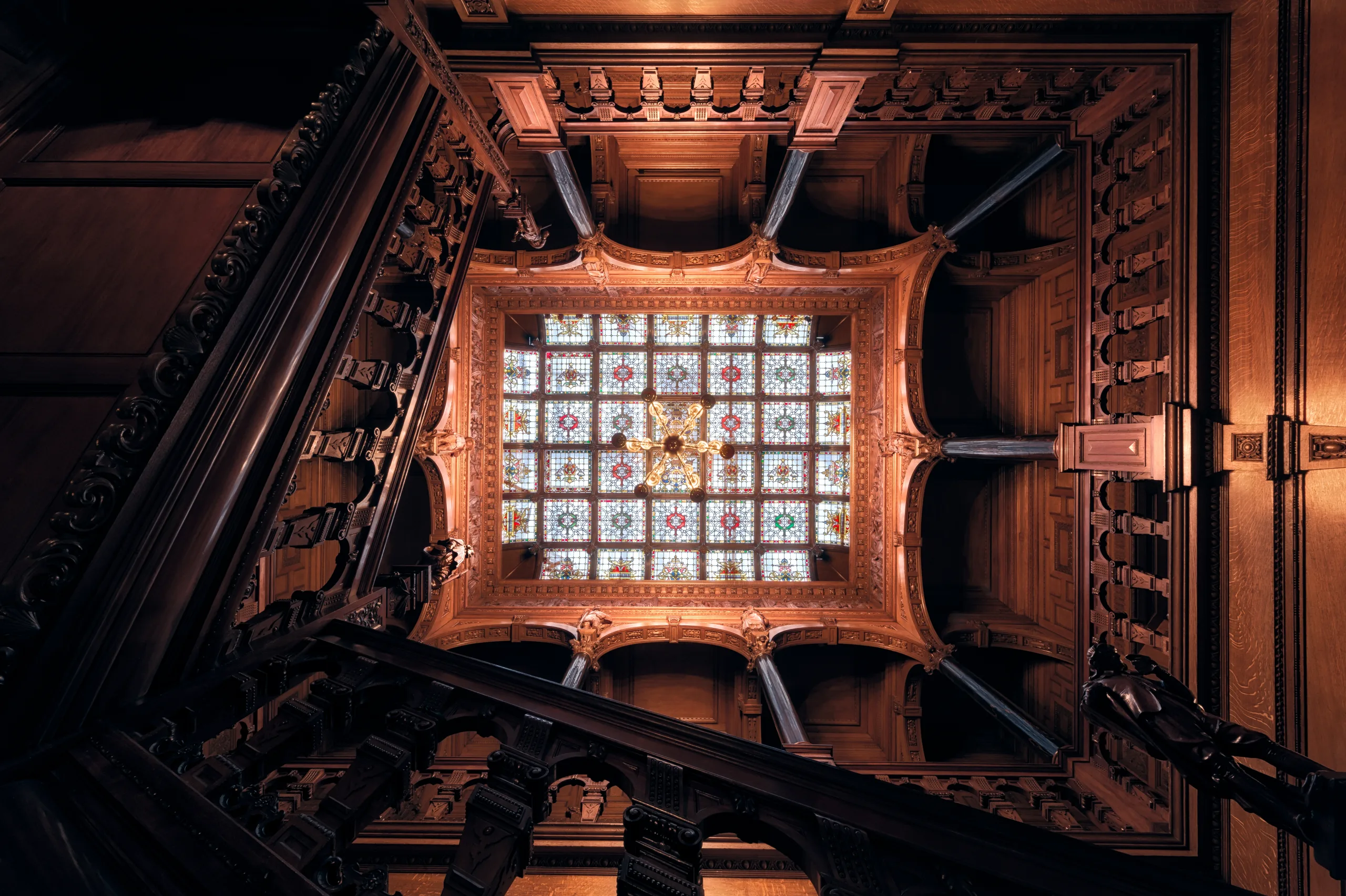 Looking up at ornate glass ceiling and staircase area of Two Temple Place